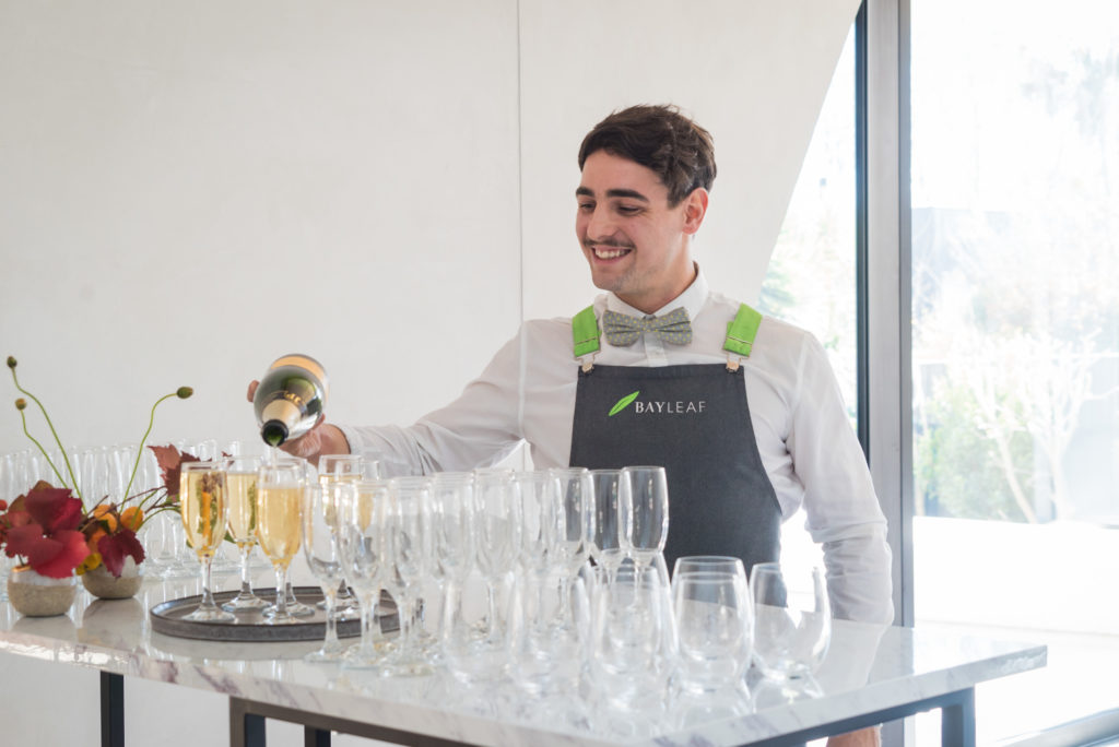 Corporate Catering Melbourne, Urban Foodies. Staff serving at corporate catering event.